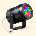 Proyector navideño negro de 16 dibujos sobre su soporte, con cable USB